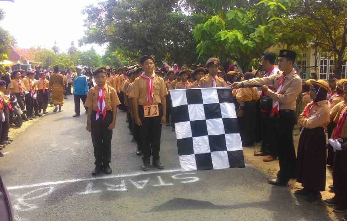 Peringati Hari Jadi Ke-57, Kwartir Ranting Pramuka Arjasa Gelar Lomba Gerak Jalan